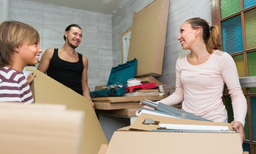Removal team planning a move in a Putney street