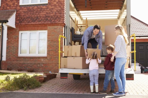 Insured man and van service in Putney handling belongings carefully