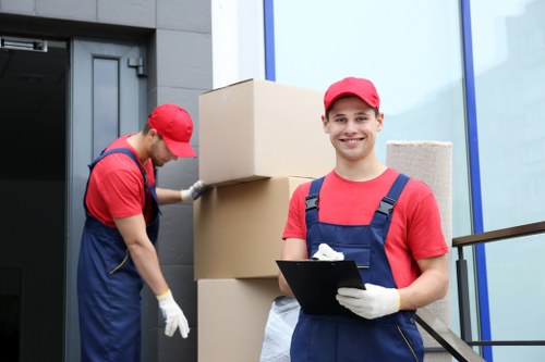 Loading household items into a van in Putney