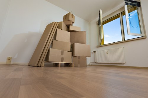Removal team planning a move in a Putney residential street