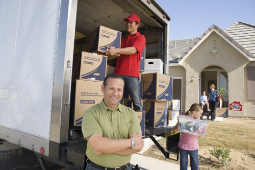 Packed boxes and furniture prepared for a Putney home removal