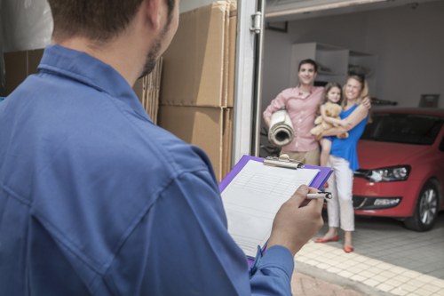Removalists loading boxes and furniture for a flat move in Putney