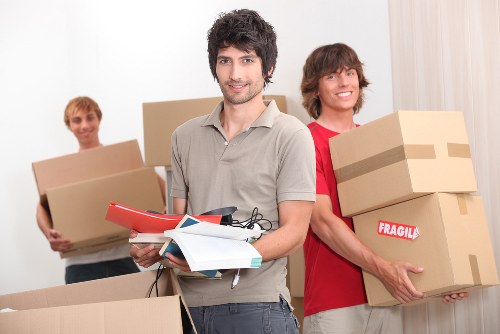 Professional movers loading furniture during a Putney removals job