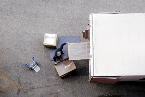 Team handling office equipment during a commercial move in Putney