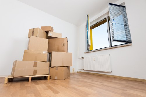 Professional movers handling household items for a Putney relocation