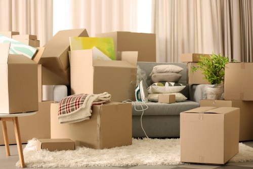 Packed boxes and furniture prepared for removal in Putney