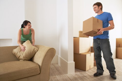 Movers carrying household items during a Putney relocation